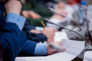 Hands, mic, paper